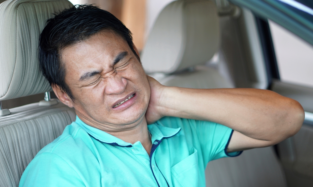 Asian,Man,Sits,In,Car,And,Feels,Hurt,His,Neck